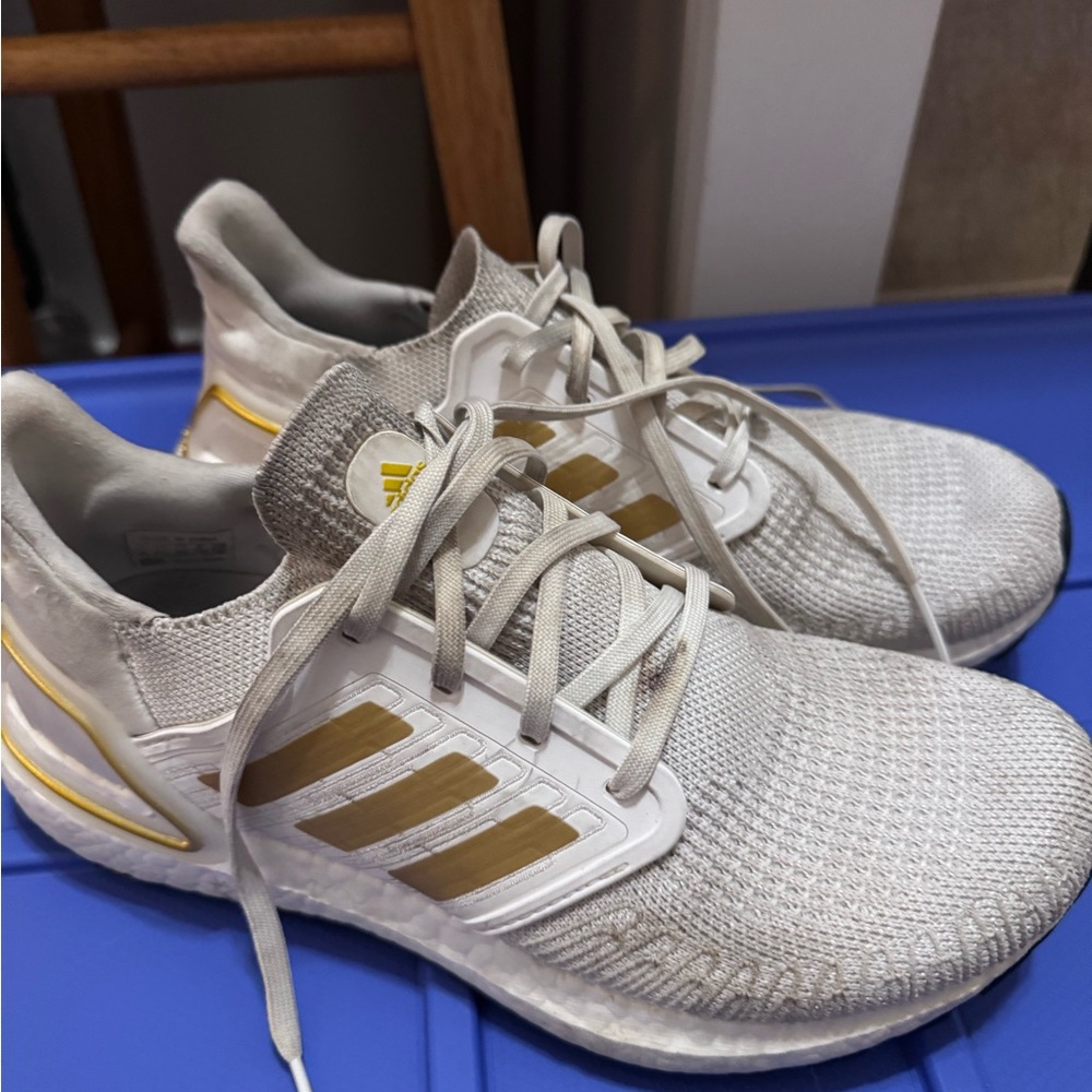 Adidas White Ultra Boost Sneakers with Gold Stripes